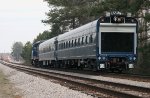 Track Geometry train awaits approach of SD70MAcs with doublestacks